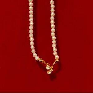 Pearl necklace with rhinestone accents plus matching earrings